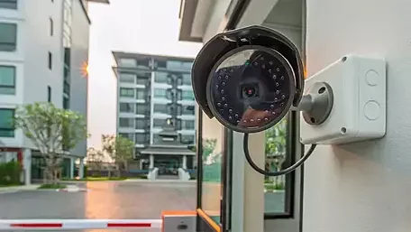 Security camera monitoring a multifamily apartment complex